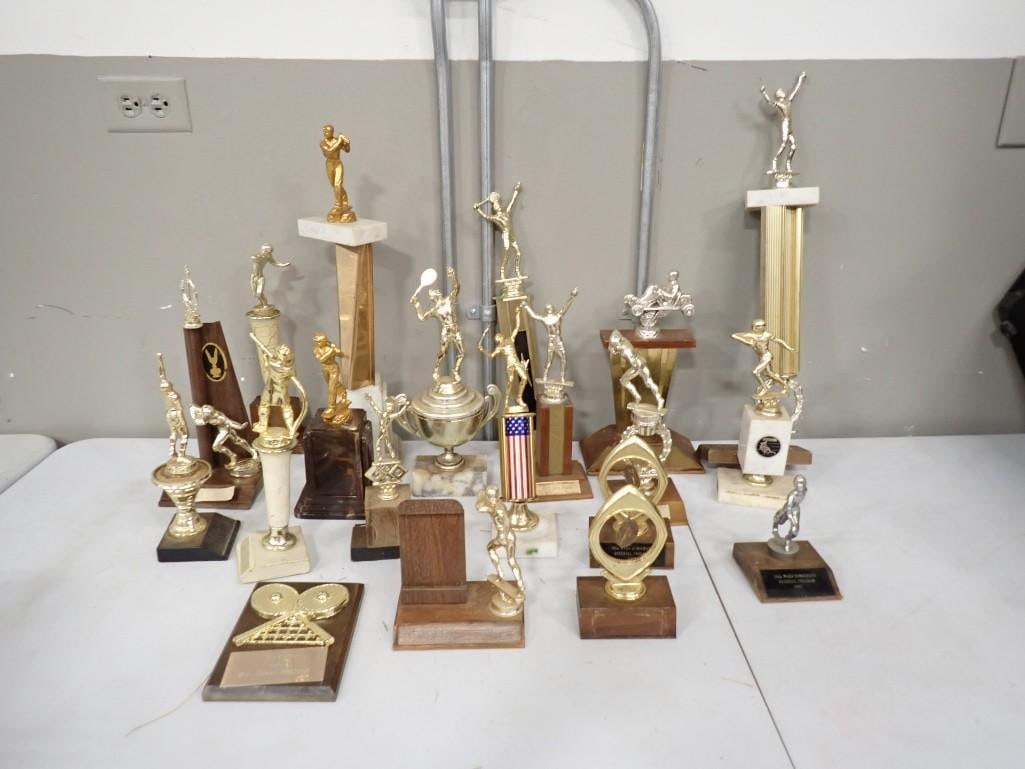 Lot of Vintage Sports Trophy's including Tennis, Baseball, Firefighting, etc.: Lot of Vintage Sports Trophy's including Tennis, Baseball, Firefighting, etc. All pictures are considered part of the description and should be examined carefully by bidders. Live Auctioneers is n