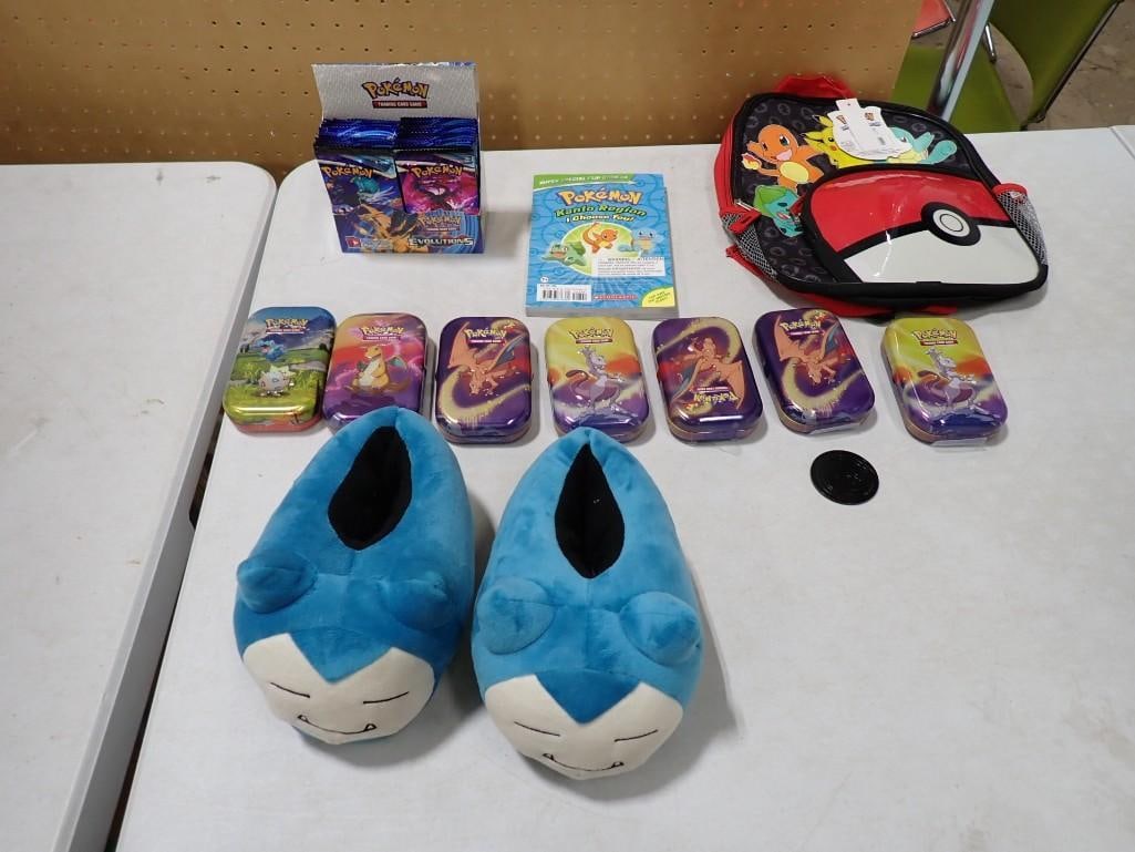 Pokemon Lot including Sealed Packs of Trading Cards, Back Pack, Plush Slippers, Collector Tins, etc.: Pokemon Lot including Sealed Packs of Trading Cards, Back Pack, Plush Slippers, Collector Tins, etc. All pictures are considered part of the description and should be examined carefully by bidders. Li