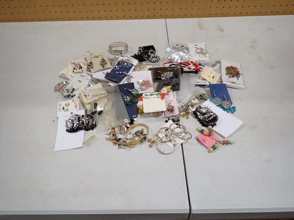 Lot of assorted Costume Jewelry including new on card earrings, watches, etc.: Lot of assorted Costume Jewelry including new on card earrings, watches, etc. All pictures are considered part of the description and should be examined carefully by bidders. Live Auctioneers is now o
