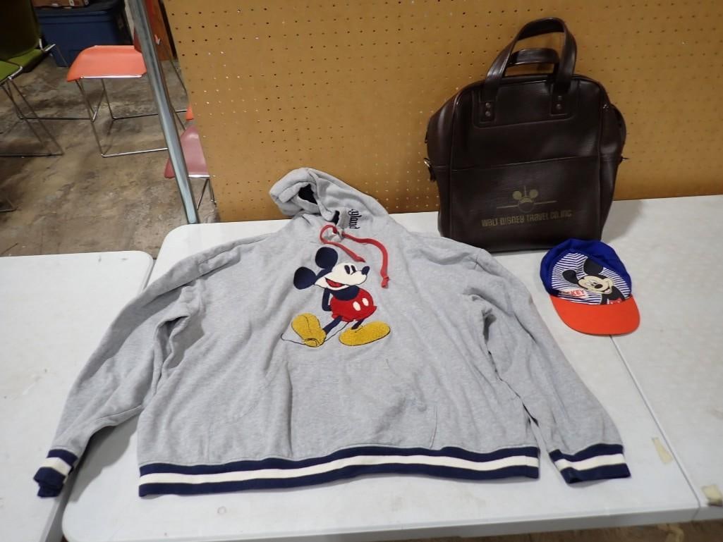 Walt Disney / Mickey Mouse Lot including Hoody, Leather Travel Bag, Hat: Walt Disney / Mickey Mouse Lot including Hoody, Leather Travel Bag, Hat All pictures are considered part of the description and should be examined carefully by bidders. Live Auctioneers is now offerin