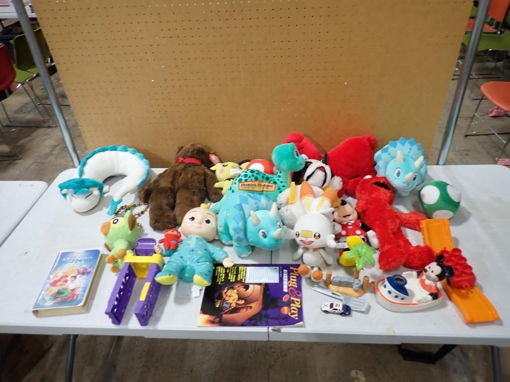 Plush / Toy Lot including Walt Disney, Pokemon, Elmo, Clifford, Dino-Rama, etc: Plush / Toy Lot including Walt Disney, Pokemon, Elmo, Clifford, Dino-Rama, etc All pictures are considered part of the description and should be examined carefully by bidders. Live Auctioneers is now 