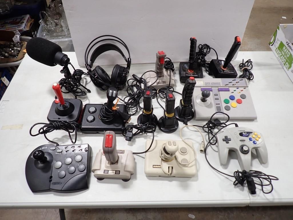 Lot of Atari and NES Nintendo Video Game Joysticks and Controllers - untested: Lot of Atari and NES Nintendo Video Game Joysticks and Controllers - untested All pictures are considered part of the description and should be examined carefully by bidders. Live Auctioneers is now o