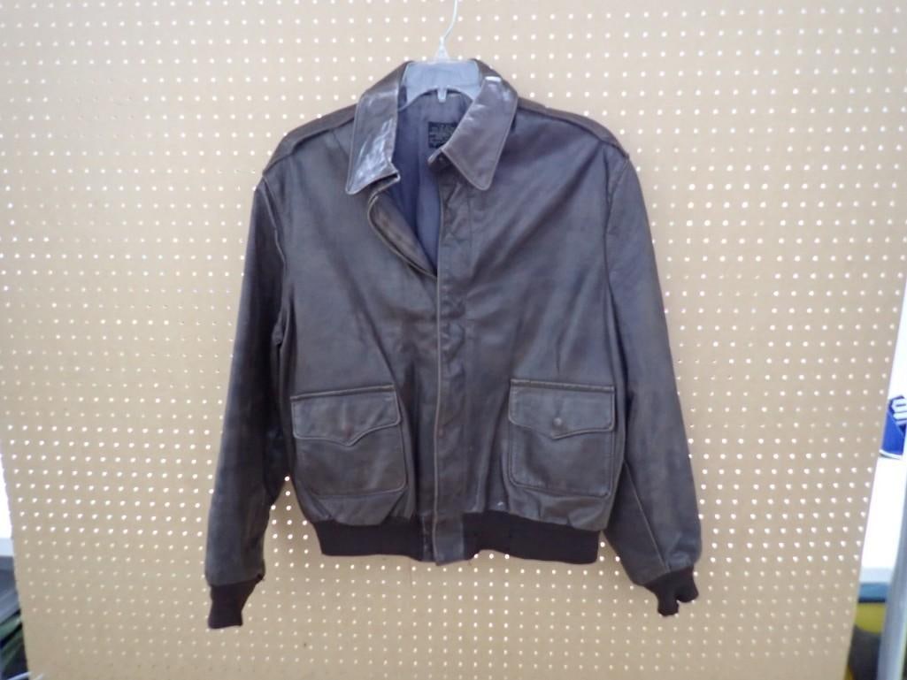 Vintage brown leather A-2 military flight jacket: Vintage brown leather A-2 military flight jacket All pictures are considered part of the description and should be examined carefully by bidders. Live Auctioneers is now offering Live Shipping through