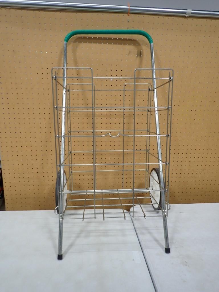 Portable folding utility and grocery cart for shopping: Portable folding utility and grocery cart for shopping All pictures are considered part of the description and should be examined carefully by bidders. Live Auctioneers is now offering Live Shipping t