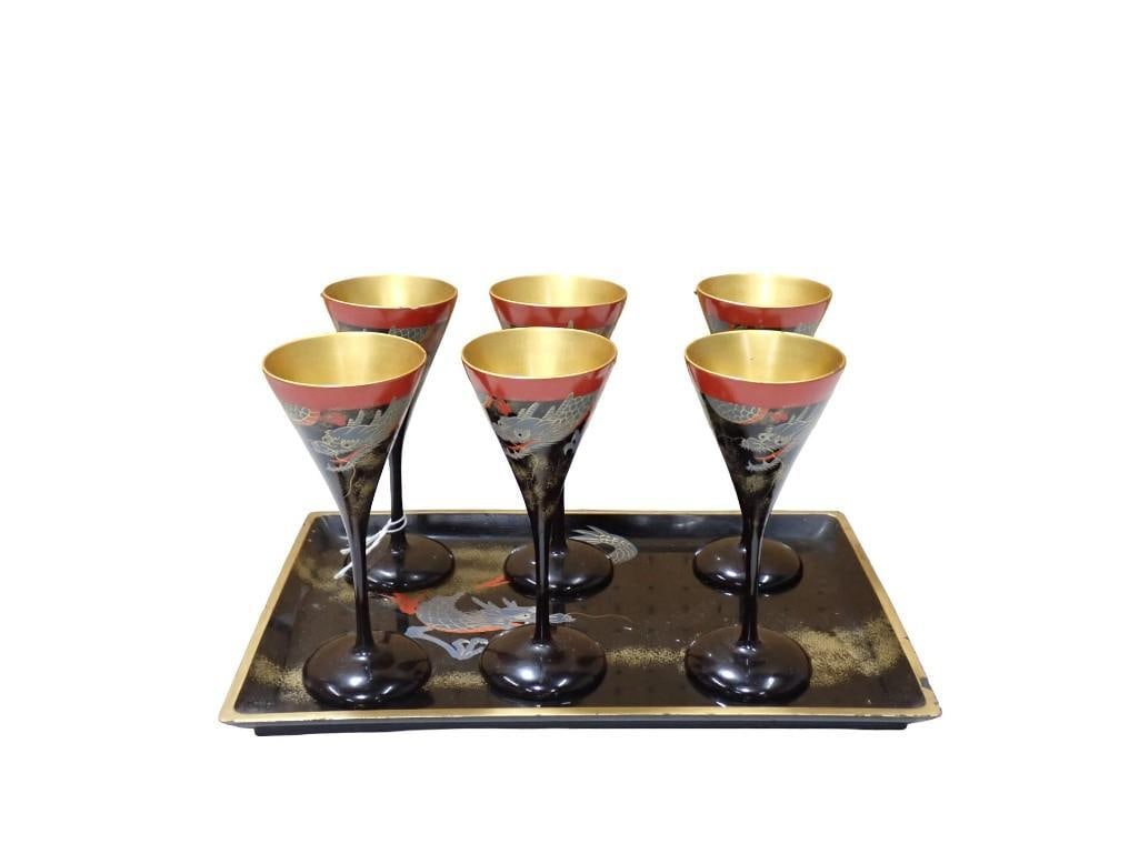 6 Japanese black and red lacquerware stemmed sake or cocktail glasses and a tray: 6 Japanese black and red lacquerware stemmed sake or cocktail glasses and a tray All pictures are considered part of the description and should be examined carefully by bidders. Live Auctioneers is no