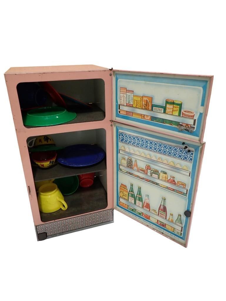 Tin Litho Pink Toy Refrigerator with Some Toy Dishes: Tin Litho Pink Toy Refrigerator with Some Toy Dishes All pictures are considered part of the description and should be examined carefully by bidders. Live Auctioneers is now offering Live Shipping thr