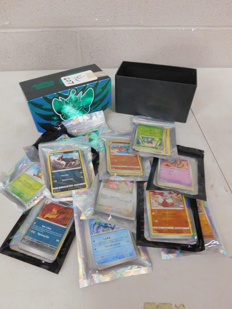 Box full of assorted Pokemon Cards (1 of 5)