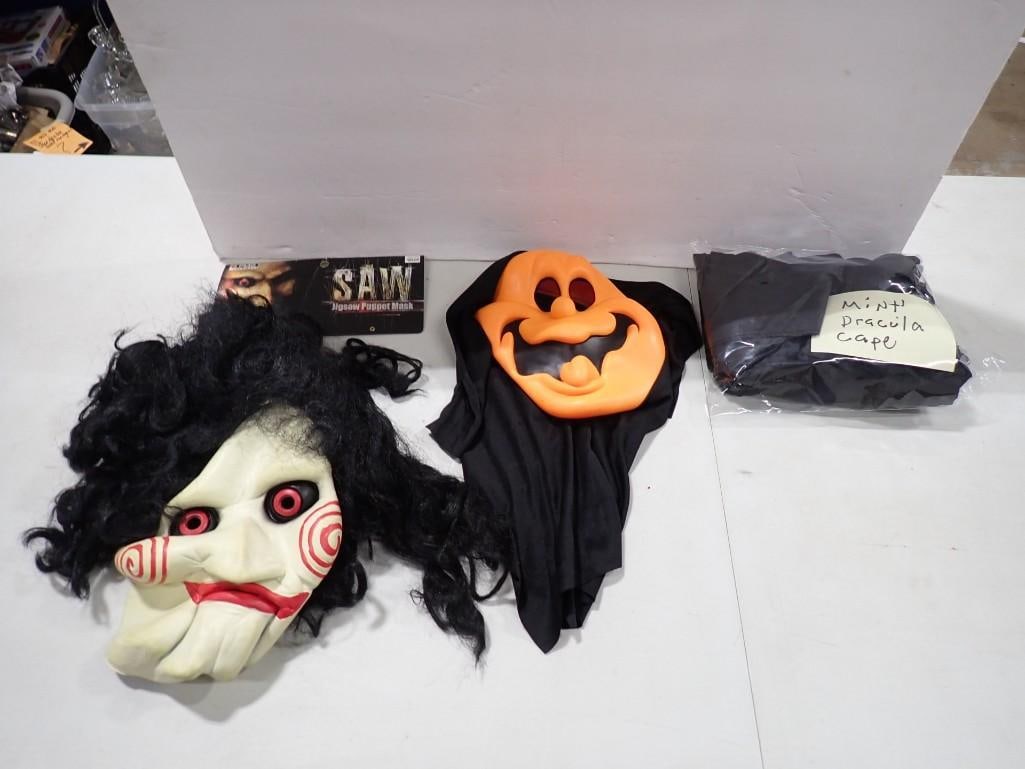 Halloween Lot including Masks, Saw Jigsaw Puppet Mask, Mini Dracula Cape: Halloween Lot including Masks, Saw Jigsaw Puppet Mask, Mini Dracula Cape All pictures are considered part of the description and should be examined carefully by bidders. Live Auctioneers is now offeri