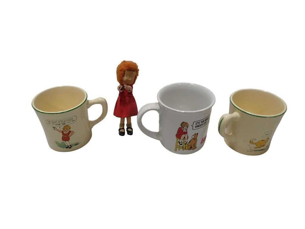Little Orphan Annie Lot incl Small Doll and Mugs: Little Orphan Annie Lot incl Small Doll and Mugs All pictures are considered part of the description and should be examined carefully by bidders. Live Auctioneers is now offering Live Shipping through