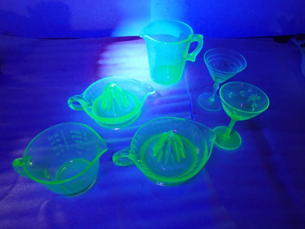 Asst Uranium Glass incl 2 Juicers, 2 Measuring Cups, 2 Champagne Glasses: Asst Uranium Glass incl 2 Juicers, 2 Measuring Cups, 2 Champagne Glasses All pictures are considered part of the description and should be examined carefully by bidders. Live Auctioneers is now offeri