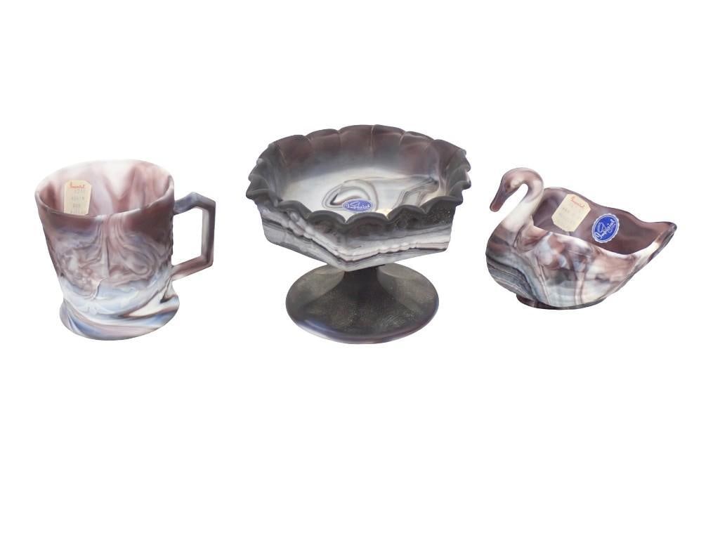 3 pc Imperial Slag Glass incl Swan Salt Cellar, 1 Mug, Footed Compote with Grape Pattern: 3 pc Imperial Slag Glass incl Swan Salt Cellar, 1 Mug, Footed Compote with Grape Pattern All pictures are considered part of the description and should be examined carefully by bidders. Live Auctionee