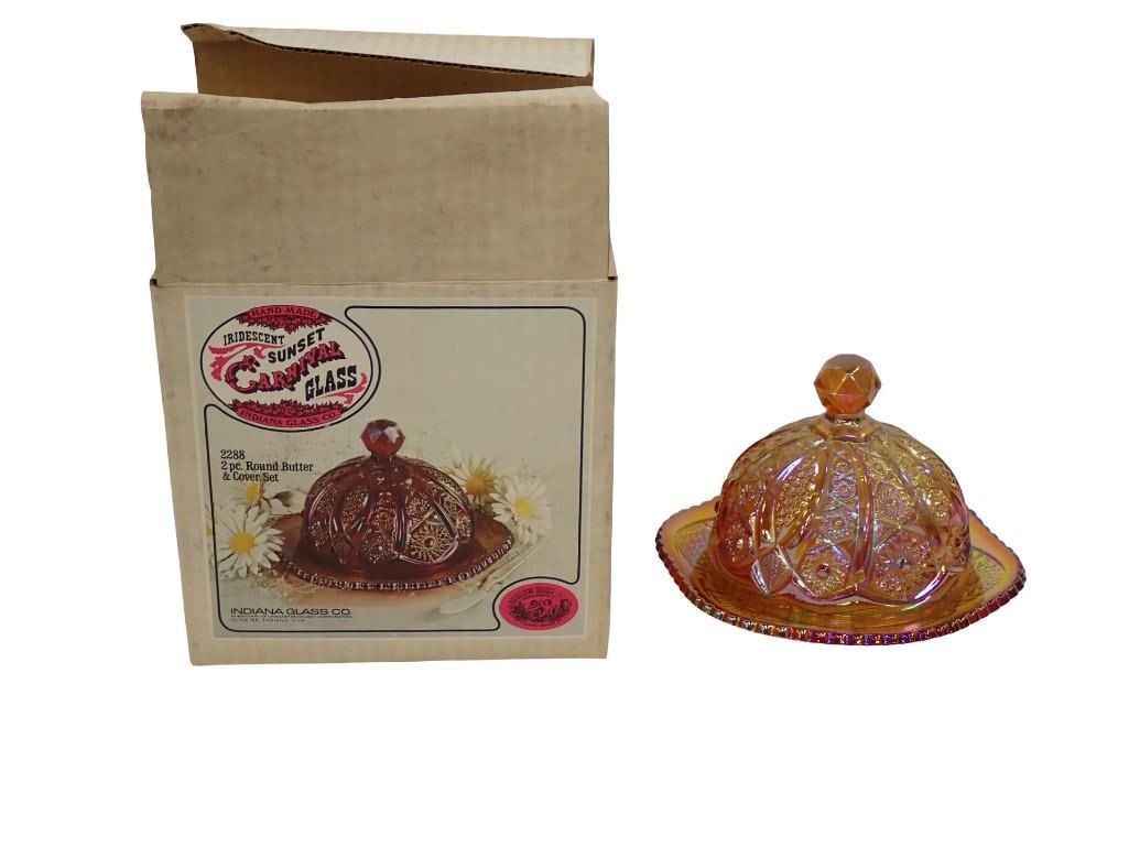 Indiana Glass 2 Pc Round Butter Dish Iridescent Sunset Carnival Glass in Original Box: Indiana Glass 2 Pc Round Butter Dish Iridescent Sunset Carnival Glass in Original Box All pictures are considered part of the description and should be examined carefully by bidders. Live Auctioneers 