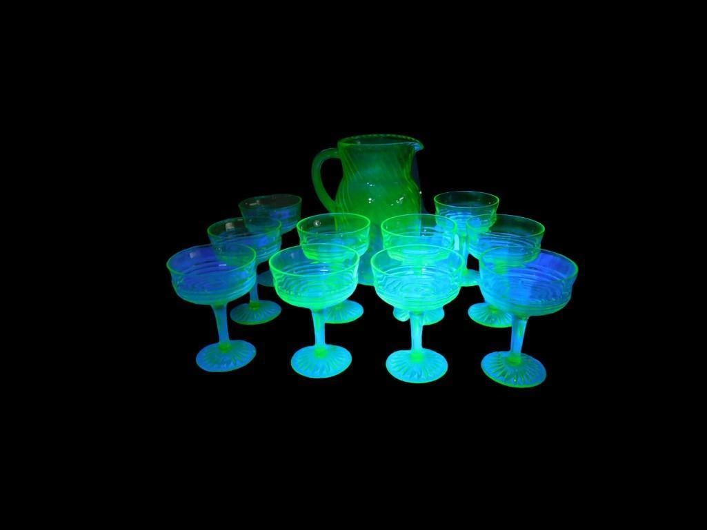 Uranium Glass 10 Footed Sundae Glasses, Pitcher: Uranium Glass 10 Footed Sundae Glasses, Pitcher All pictures are considered part of the description and should be examined carefully by bidders. Live Auctioneers is now offering Live Shipping through 