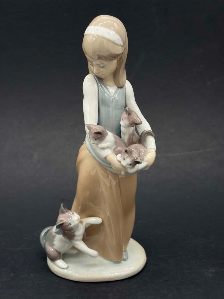 Lladro Following Her Cats 1309 Porcelain Figurine: Lladro Following Her Cats 1309 Porcelain Figurine. Great Condition, No Chips. . All Pictures Are Considered Part Of The Description And Should Be Examined Carefully By Bidders.. Live Auctioneers Is No