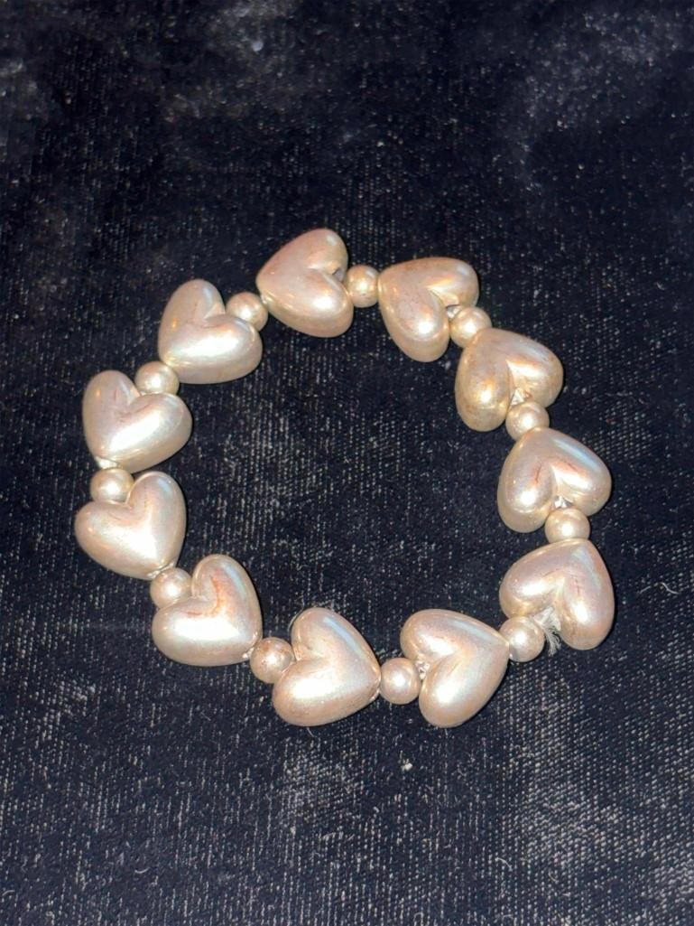 Vintage Puffy Heart Sterling Silver Bracelet: Vintage Puffy Heart Sterling Silver Bracelet. 20 Grams, Excellent, Need Polishing. . All Pictures Are Considered Part Of The Description And Should Be Examined Carefully By Bidders.. Live Auctioneers