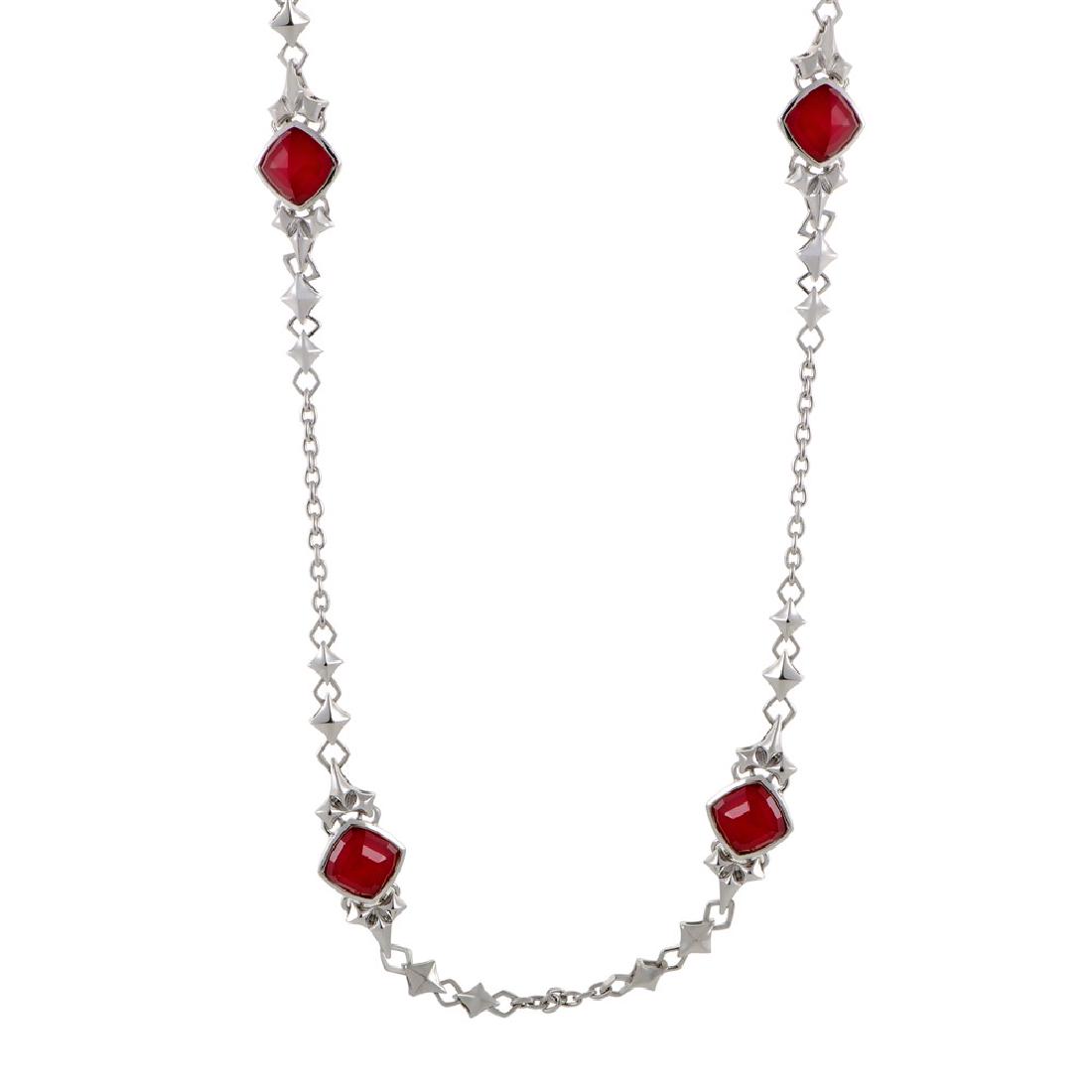 Stephen Webster Superstud Womens Silver Coral and: Standing out in brilliant fashion against the wonderfully bright backdrop of white rhodiumplated silver and quartz, the amazing synthesized red coral stones lend their passionate spirit to this marvel
