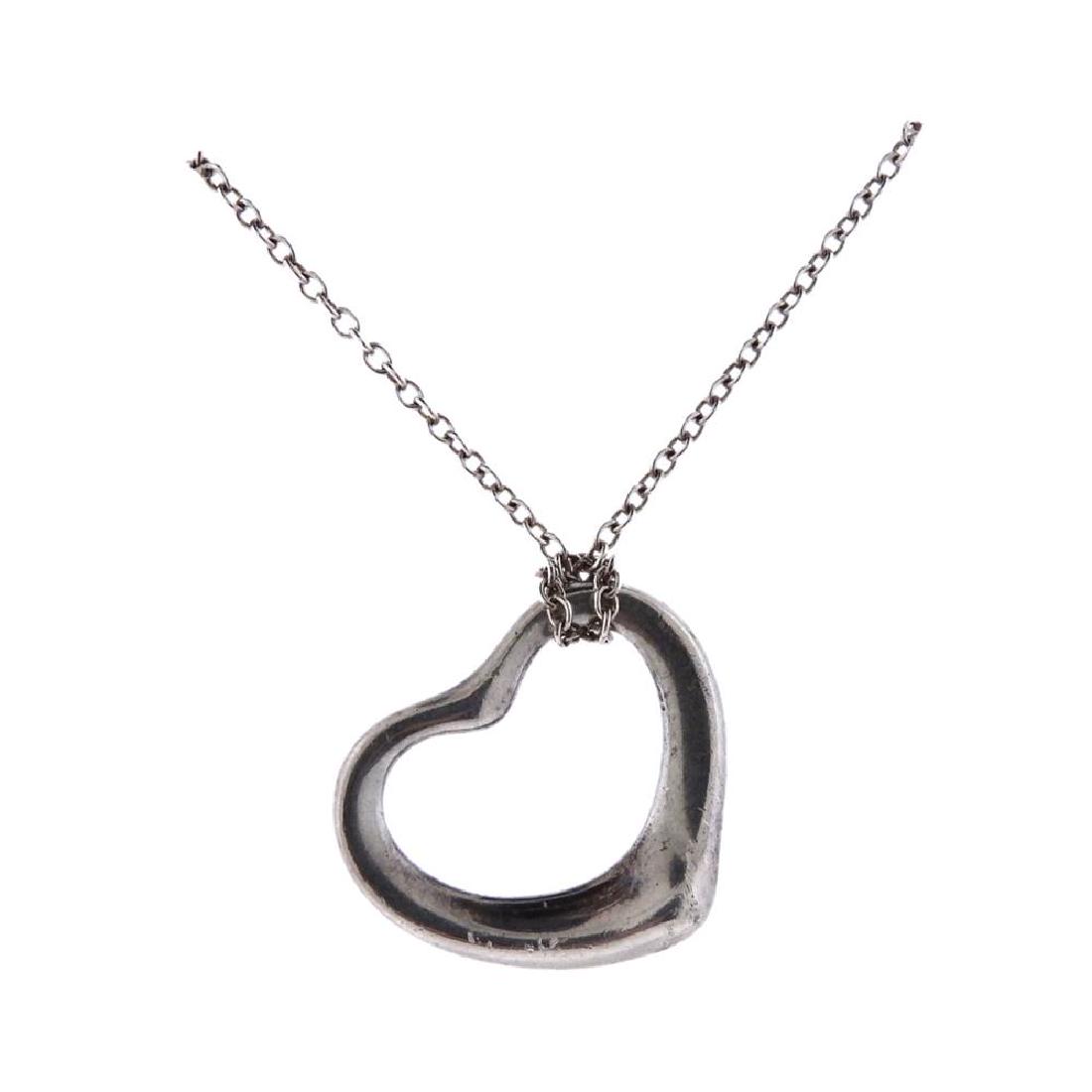 Tiffany & Co Elsa Peretti Open Heart Silver Heart: Metal Content: Sterling SilverWeight of Item: 5.1 gramsSize: Chain length - 16", heart - 21mm x 22mm. Gemstone: n/aStamp: Tiffany & Co, Elsa Pereti, 925.
