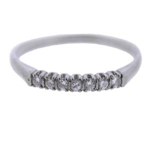 Platinum Diamond Ring: Metal Content: Platinum.Weight of Item: 2.7 grams.Size: Ring size 9.5, width of the top 2.2mm. Gemstone: Diamond.Carat Weight: 0.14ctw.Stamp: Hand Made, 10% irid. Platinum.