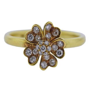 18k Gold Diamond Flower Ring: Metal Content: 18k Gold. Weight of Item: 3 grams.Size: Ring size 6.5, flower top is 10mm x 10mm.Gemstone: Diamond.Carat Weight: 0.36ctw.Stamp: 750.