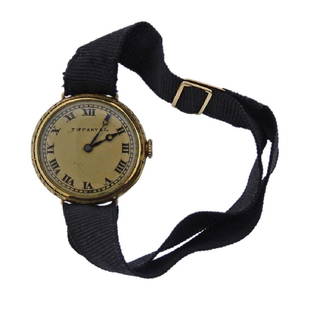 Antique Longines for Tiffany & Co 18k Gold Watch: Metal Content: 18k Gold (case). Fabric band and 18k Buckle (all original).Size: Case diameter - 36.5mm Band length is adjustable to fit most sizes.Movement: Manual Wind. Non working order. Longines