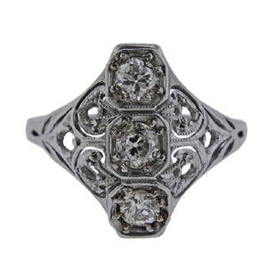 Art Deco Filigree Platinum Diamond Ring: Metal Content: platinumWeight of Item: 3.8 gramsSize: Ring size 6.5. Top of the ring 16.5 mmGemstone: Diamonds (small side stones are missing).Carat Weight: 0.30ctw.Stamp: N/A, tested platinum