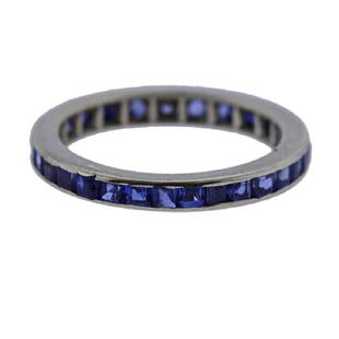 14k Gold Sapphire Eternity Wedding Ring: Metal Content: 14k Gold.Weight of Item: 1.3 grams. Size: Ring size - 5, width - 2.2mm. Gemstone: Sapphires (one stone was replaced). Stamp: Not stamped. Tested 14k.