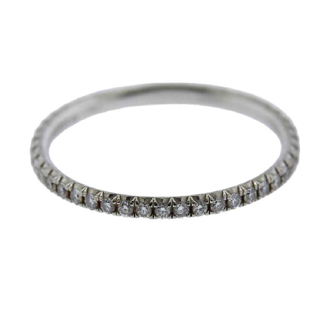Tiffany & Co Metro 18k Gold Diamond Band Ring: Metal Content: 18k Gold.Weight of Item: 1.2 grams.Size: Ring size - 6 1/2, width - 1.5mm.Gemstone: Diamonds.Carat Weight: approx. 0.21ctw.Stamp:Tiffany & Co, 750, Belgium.