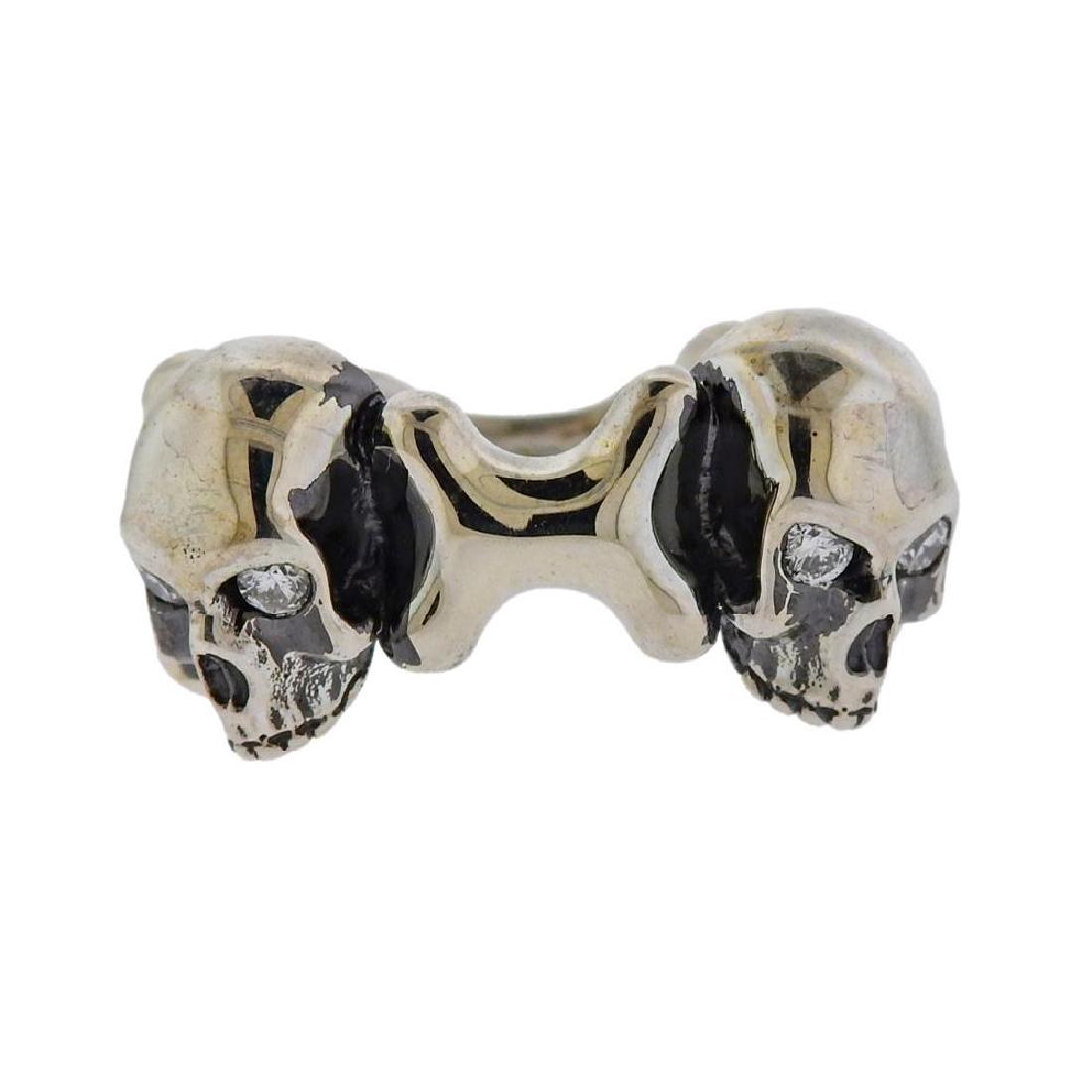 Stephen Webster Silver Diamond Double Skull Ring: Metal Content: Sterling silver. Weight of Item: 17.6 grams.Size: Ring size 11. Top of the ring 13mm.Gemstone: Diamonds.Carat Weight: approx.0.16ctw.Stamp: Stephen Webster 925.