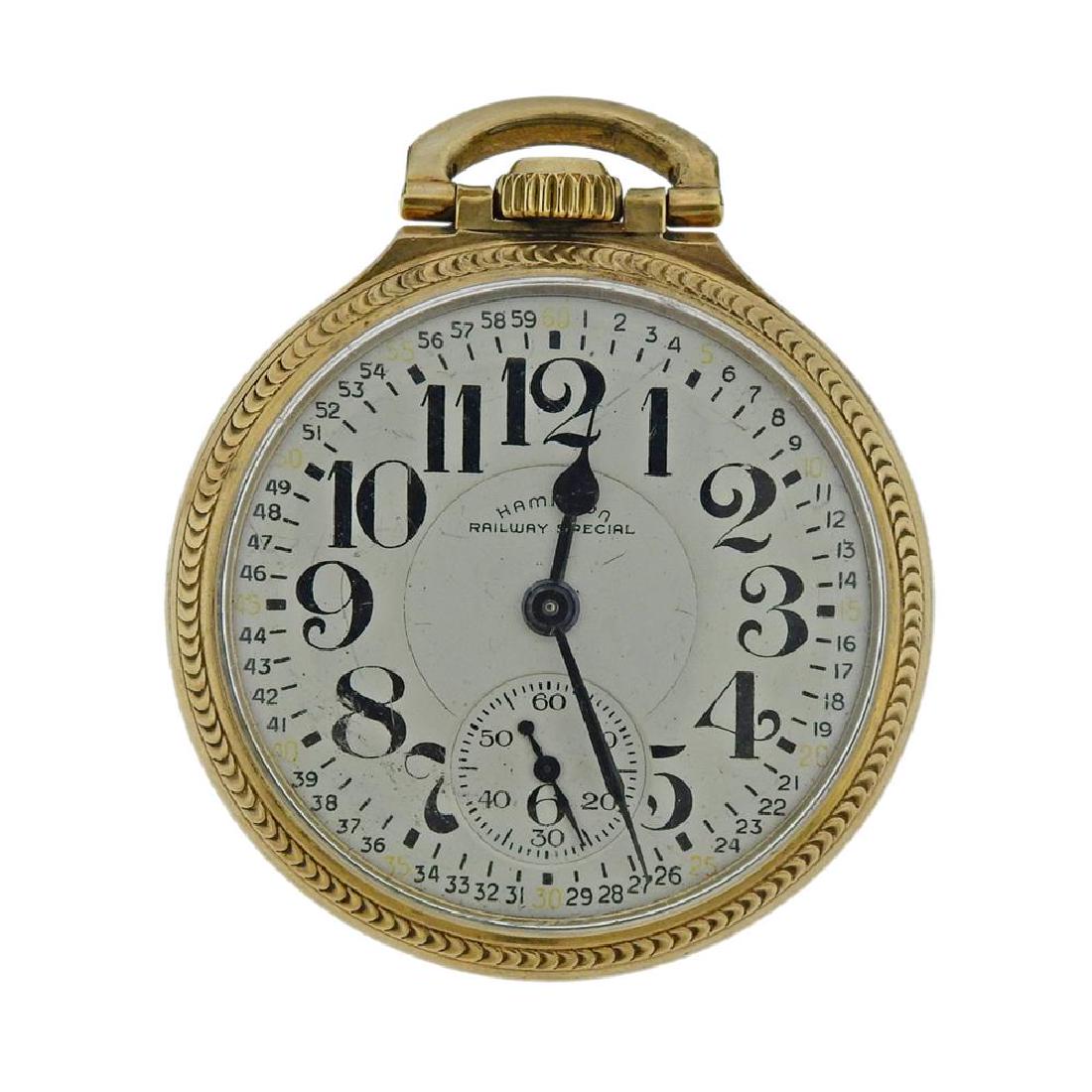 Hamilton Railway Special Railroad Pocket Watch 992B: Metal Content: 10K gold filledDial: White dial with black Arabic numeral markers and hands. Second dial at 6 o'clock position.Size: Case 50mm in diameter.Movement: Manual wind, not working order.