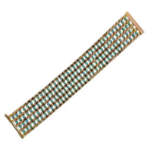 14K Gold Turquoise Bracelet: Metal Content: 14k Gold.Weight of Item: 32.2 grams.Size: Bracelet is 7.5" long x 32mm wide.Gemstone: Turquoise. One stone is missing.Stamp: Tested 14k.1414.