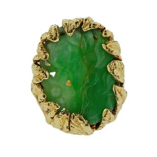 14K Gold Carved Jade Ring: Metal Content: 14k Gold.Weight of Item: 14.3 grams.Size: Ring size 7 1/4, ring top - 24mm x 19mm at widest point.Gemstone: Carved Jade.Gemstone fractured.Stamp: Tested 14k