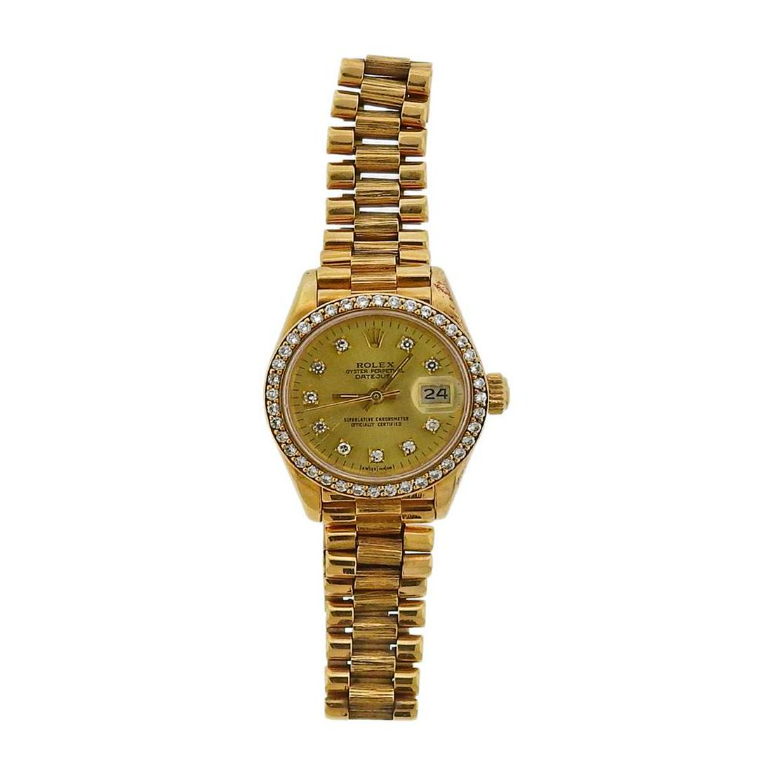 Rolex President Diamond 18k Gold Champagne Dial: Metal Content: 18k Gold. Dial: Champagne Rolex dial with diamond marks and bezel, date at 3 o'clock. Size: Case - 26nn excl crown, jubilee bark finish 18k gold band - will fit up to 7.25" wri
