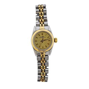 Rolex Two Tone 18k Gold Steel Lady's Watch ref.: Metal Content: 18k Gold/ Stainless Steel. Dial: Champagne Rolex dial with gold stick marks. Size: Case - 25mm without crown. Crystal is chipped. Jubilee band (shows some stretching), will fit