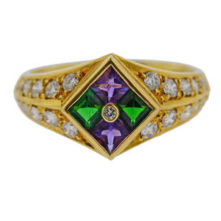 18k Gold Diamond Amethyst Peridot Ring: Metal Content: 18k Gold. Weight of Item: 5.1 g.Size: Ring size 7.25, top width - 11mm.Gemstone: Diamond, Amethyst, Peridot.Carat Weight: 0.57ctw, 0.38ctw, 0.48ctw.Stamp: A0.38, D0.57, G0.48, k18.