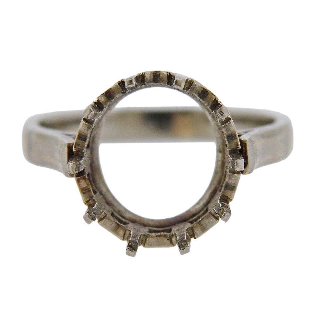 Platinum Ring Mounting: Metal Content: Platinum. Weight of Item: 4.3 g. Size: Ring size - 5.75, center will hold stone about 11mm in diameter.Gemstone: n/aStamp: n/a. Tested platinum. Marks on outside.