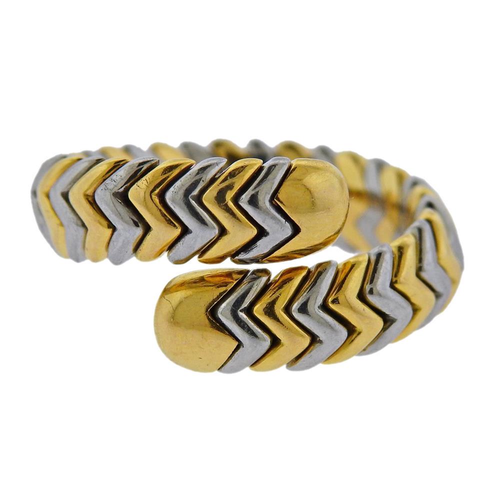 Bvlgari Bulgari 18k Gold Steel Spiga Wrap Ring: Metal Content: 18k Gold/ Stainless Steel. Weight of Item: 8.9 g. Size: Ring size - 7, width - 12mm. Gemstone: n/a.Stamp: Bvlgari, 750, Maker's stamp.