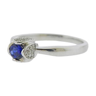 Piaget 18k Gold Diamond Sapphire Tulip Ring: Metal Content: 18k white gold.Weight of Item: 7.2 grams.Size: Ring size 10 1/2, ring top - 7.7mm wide.Gemstone: Diamonds. Sapphire - 5mm in diameter.Carat Weight: approx. 0.32ctw.Stamp: Piaget 55, 