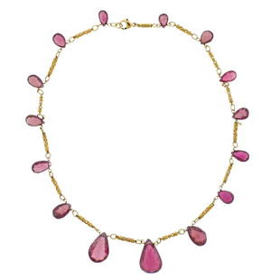 Yanes 18K Gold Pink Gemstone Necklace: Metal Content: 18k yellow gold. Weight of Item: 27.4 grams.Size: Necklace is 18" long.Gemstone: Pink gemstones.Stamp: Yanes 750.