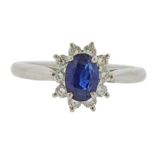 Tiffany & Co Platinum Diamond Sapphire Ring: Metal Content: Platinum.Weight of Item: 4.4 grams.Size: Ring size 6, ring top - 10.7mm at widest point.Gemstone: Diamonds. Sapphire -7mm x 5mm.Carat Weight: approx. 0.30ctw.Stamp: Tiffany & Co,