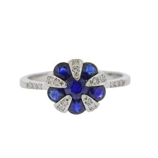 14K Gold Diamond Sapphire Ring: Metal Content: 14k White Gold.Weight of Item: 3 grams.Size: Ring is 7, ring top - 10.4mm at widest point.Gemstone: Diamonds. Sapphire.Carat Weight: approx. 0.11ctw.Stamp: 14K ID.