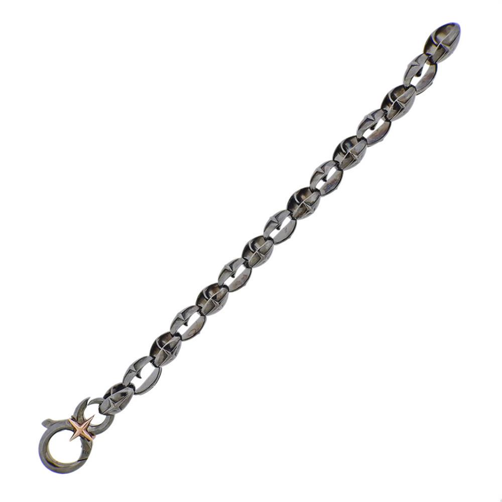 Stephen Webster North Star Thorn Silver Oval Link: Metal Content: Sterling Silver.Weight of Item: 65 grams.Size: Bracelet is 8.5" long x 18mm at widest point.Stamp: 925 Maker's mark.