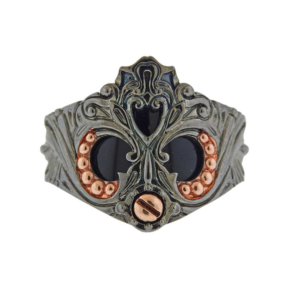 Stephen Webster No Regrets Sterling Silver Black: Metal Content: Rose Gold Plated Sterling Silver, Black Rhodium .Weight of Item: 16.4 grams.Size: Ring is 10 3/4, top of ring is 21mm long .Gemstone: Onyx.Stamp: 925 Maker's mark.