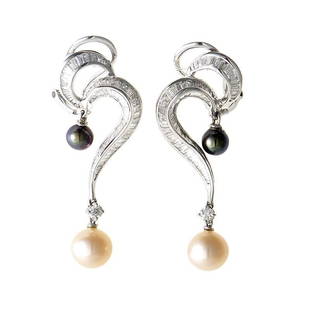 18K White Gold Diamond Black & White Pearl Earrings: This pair of drop earrings are gorgeous and feminine. They are made of 18K white gold and are set with 2.62ct of diamonds. Lastly, the earrings each boast a dangling black and white pearl.