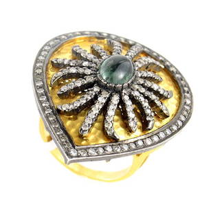 18K Yellow Gold Tourmaline Diamond Shield Ring - 7.25: This ring is unique and pops with color. The setting is made of 18K yellow gold and boasts an accent partially dipped in black rhodium. The accent features an 1.50ct tourmaline cabochon accented with