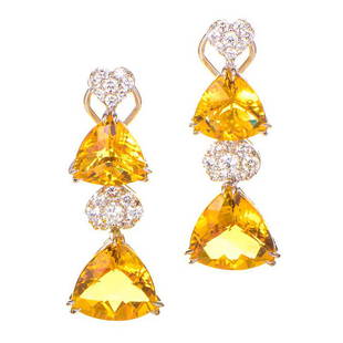 18K White Gold Diamond and Citrine Drop Earrings: This pair of drop earrings are bright and fashionable. They are made of 18K white gold and are set with citrine stones accented with 1.98ct of diamonds.