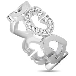 Cartier 18K WG Diamond Heart Ring Size 5.0: This Cartier ring is made of 18K white gold and embellished with diamonds. The ring weighs 7.4 grams and boasts band thickness of 7 mm. Offered in estate condition, this jewelry piece includes the