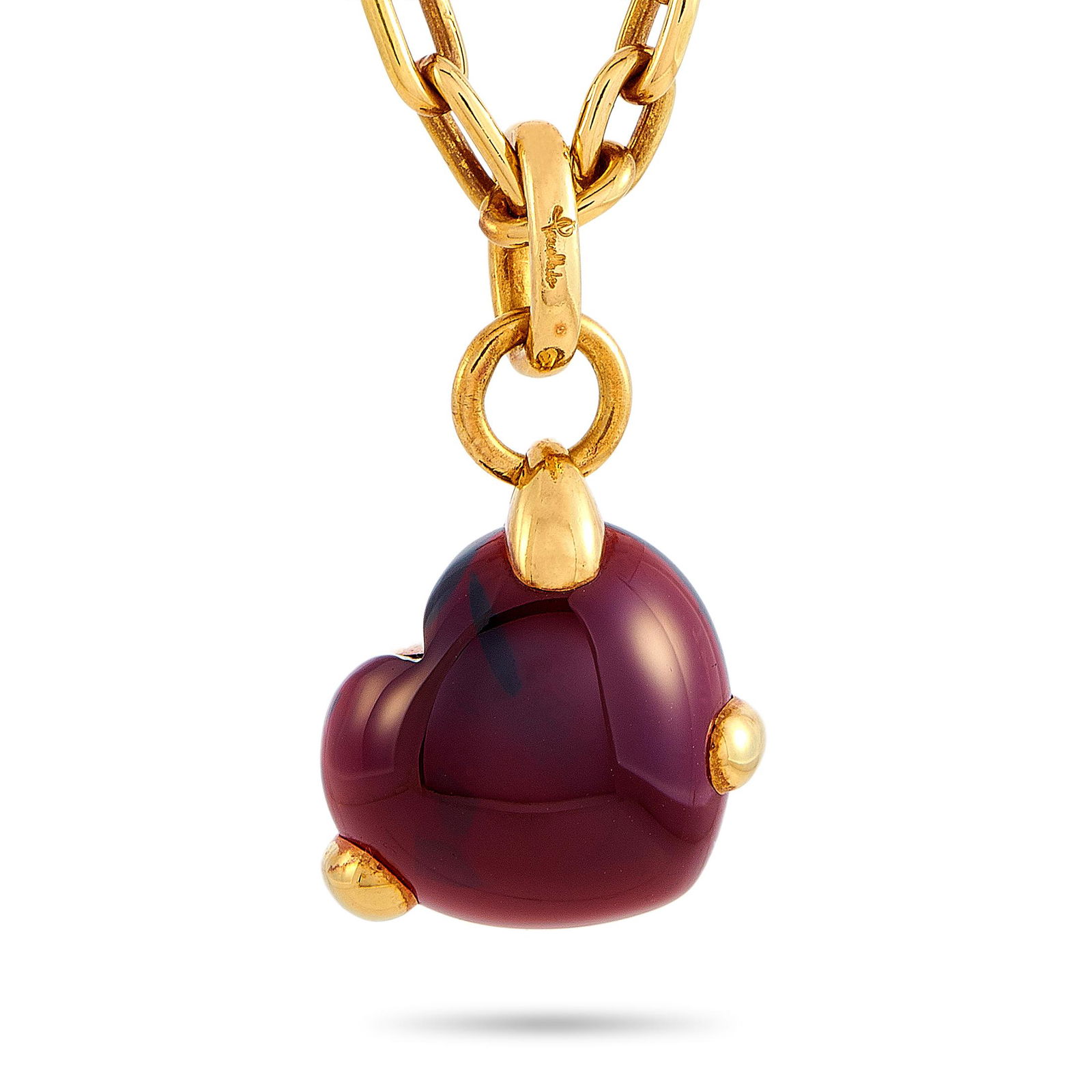 Pomellato 18K YG Garnet Heart Shaped Pendant Necklace: This Pomellato necklace is crafted from 18K yellow gold and embellished with a garnet. The necklace weighs 37.7 grams and is presented with a 16 chain and a pendant that measures 1.25 in length and 0.