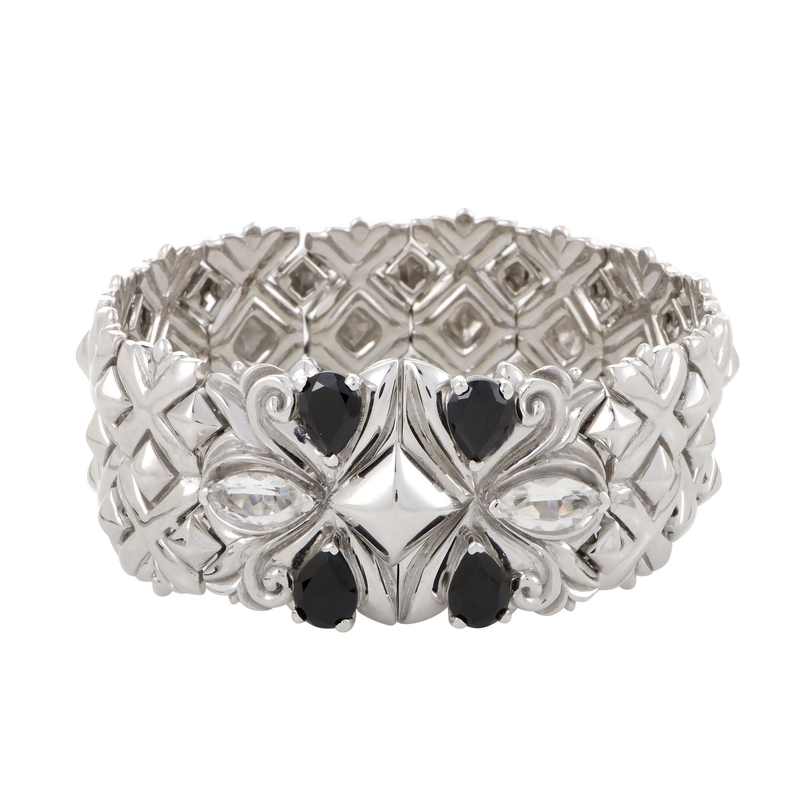 Stephen Webster Silver Black Quartz Bracelet: Employing the most striking of contrasts between neatly faceted black spinels totaling 4.99 carats and white rhodiumplated silver with glistening quartz stones, this charming bracelet from Stephen Web