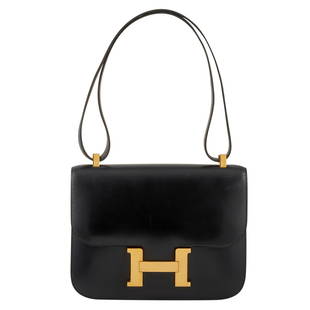 Hermes Constance 23cm Black Box Leather Handbag: Chic and streamlined, the Hermes Constance Handbag, circa 1995, possesses a timeless sense of sophistication. Made from calfskin, the desirable black box leather develops a stunning patina over time.