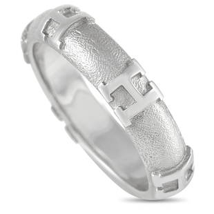 Hermes Hermes 18K WG H Band Ring Size 5.5: 18K White Gold provides the perfect foundation for this simple, stylish band ring from Hermes. Textured metal offsets sleek H motifs, putting the luxury brands iconic signature boldly on display.